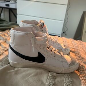 Nike White High-Top Sneakers with Black Swoosh